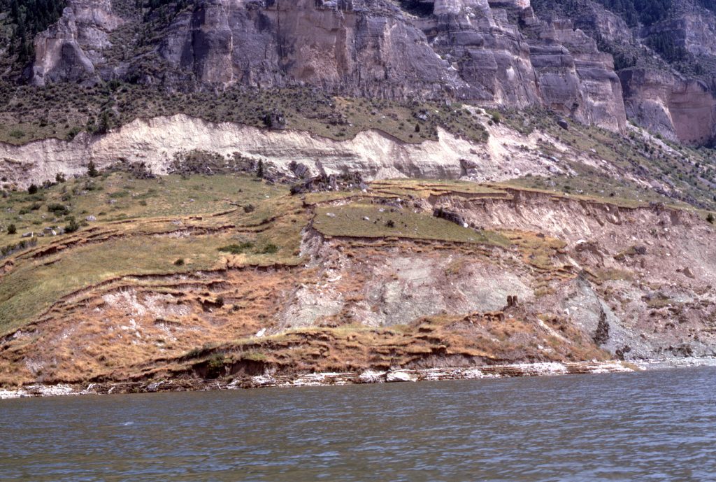an eroded hill on a river