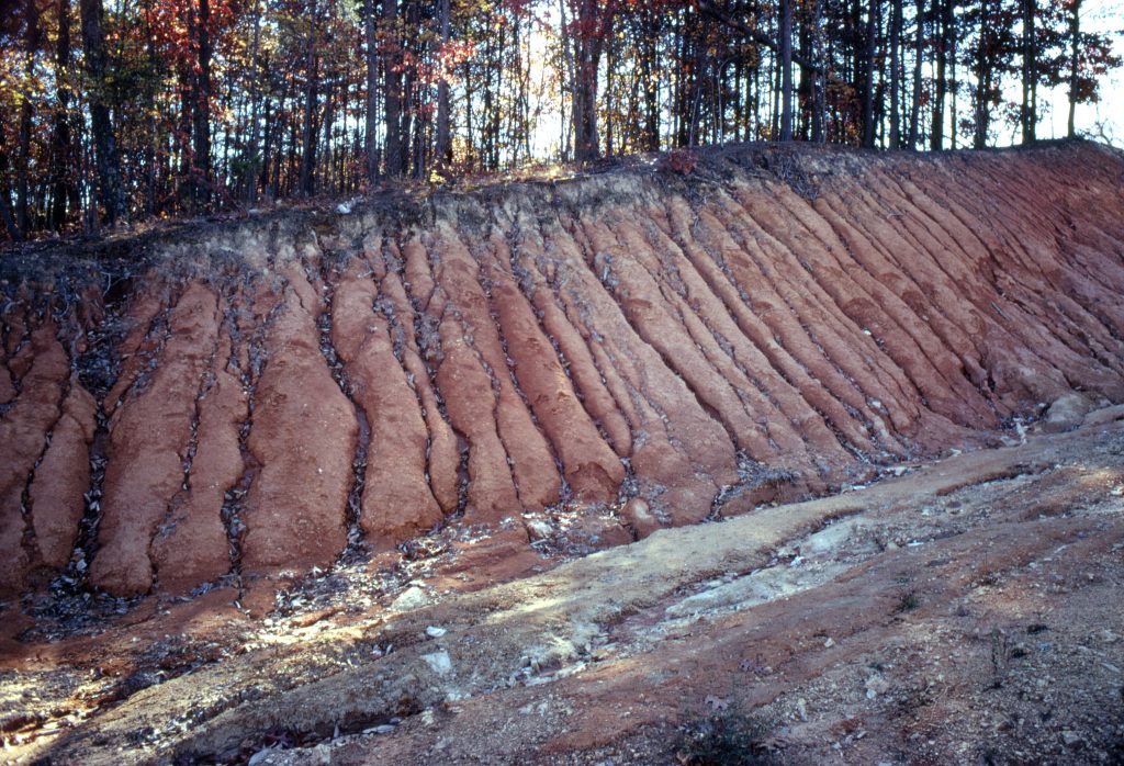 a hill with eroded soil