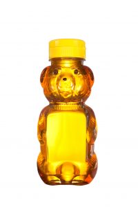 a bottle of honey shaped like a bear