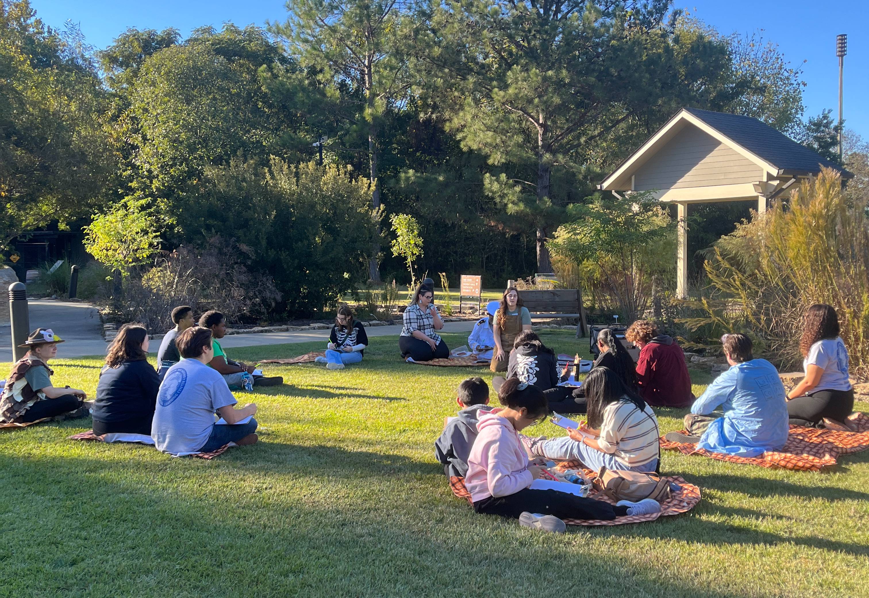 People nature journaling outside