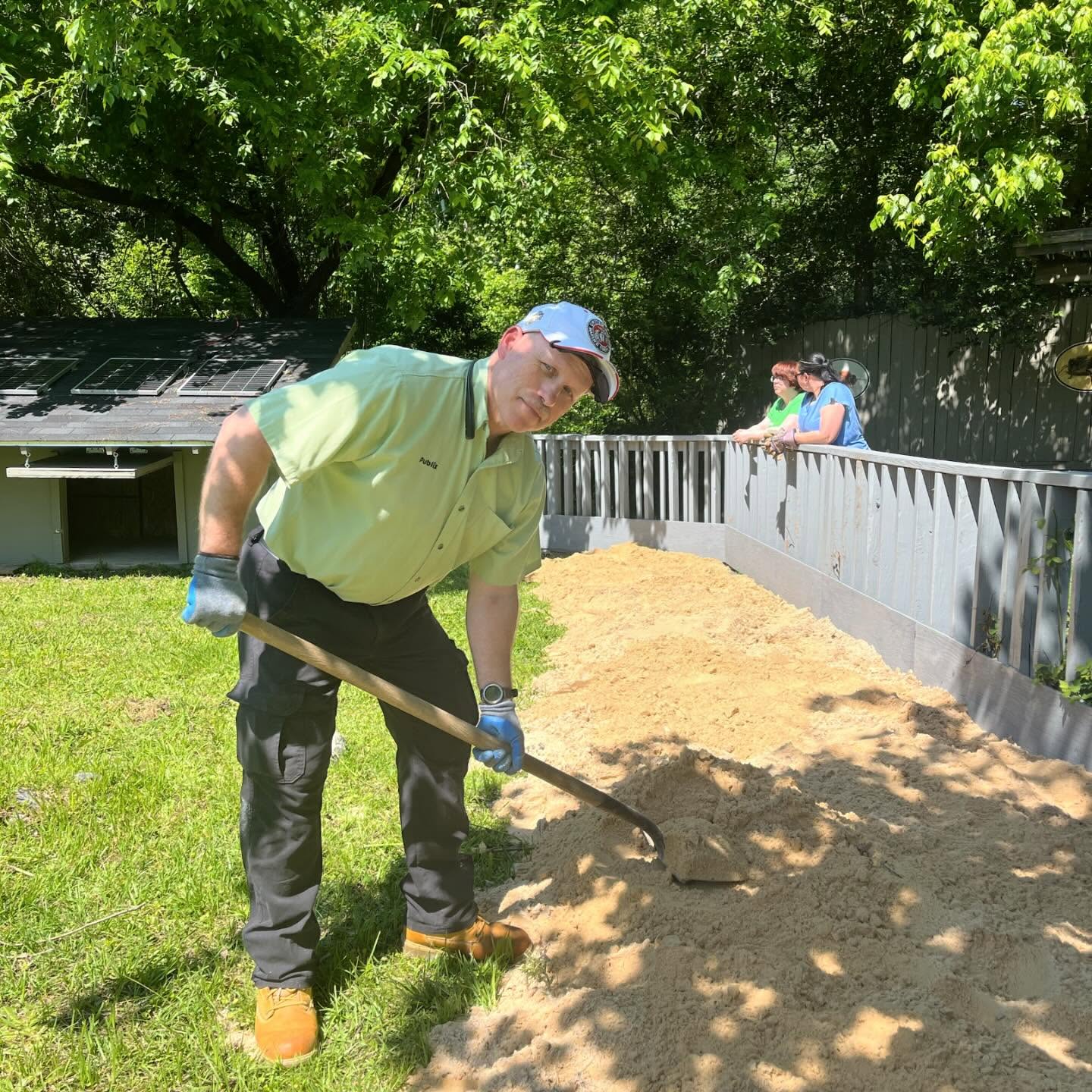 Volunteer moving sand